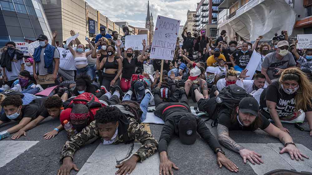 Protesters peacefully surrender in the downtown streets of Nashville during a Black Lives Matter protest.