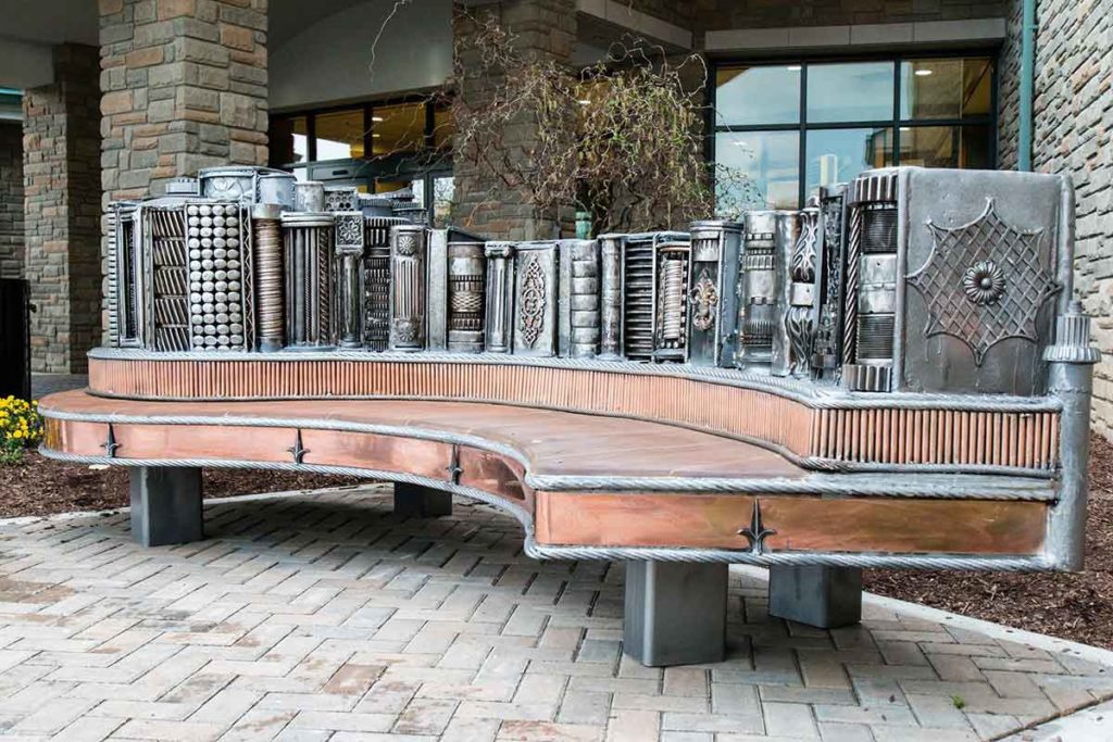 Valentine Adams metal bench sculpture called “Read and Unwind” at Brentwood, Library in Tennessee