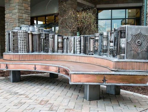 Valentine Adams metal bench sculpture called “Read and Unwind” at Brentwood, Library in Tennessee