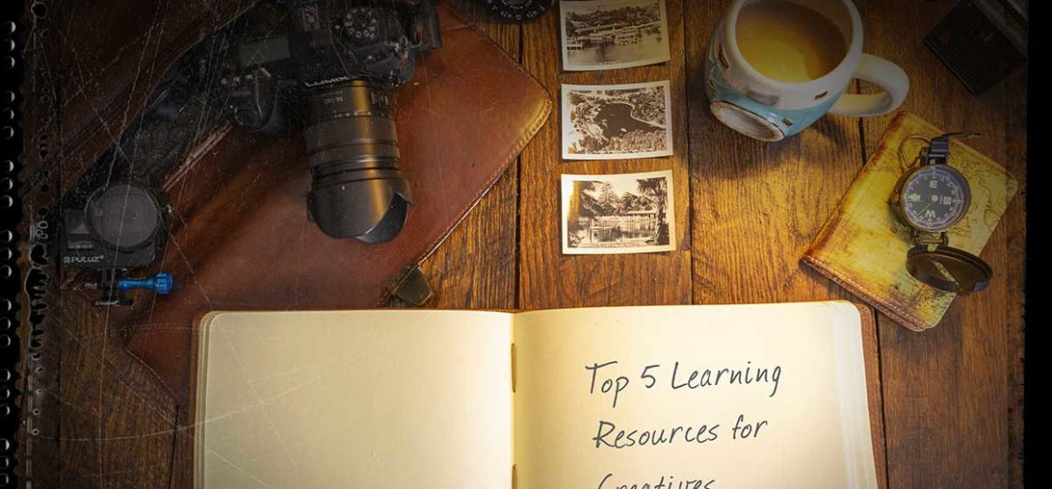 Open book with top 5 learning resources for creatives.