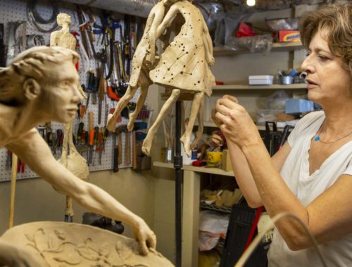 Sculptor Theresa Dyer working with clay