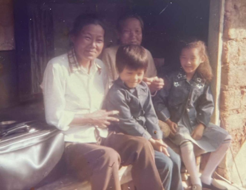 James Suh with his mother, father and sister in Korea