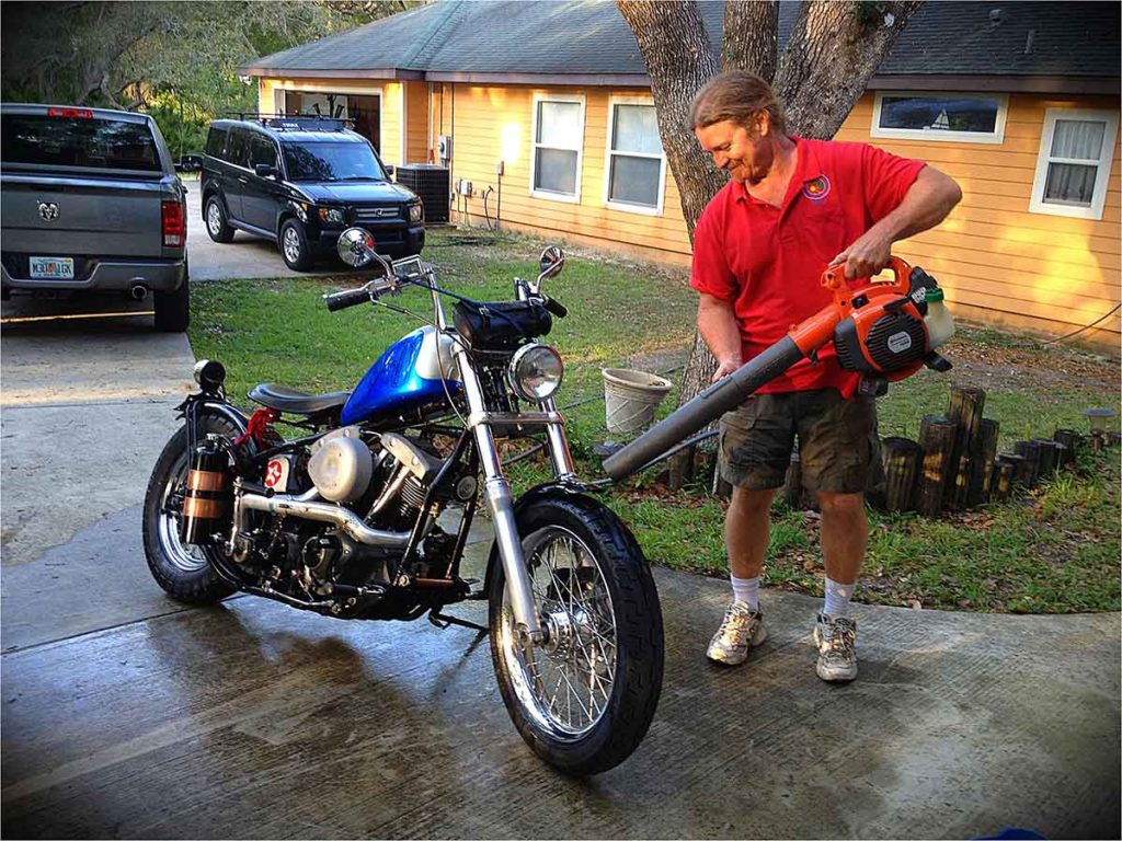 Man drying Harley Davidson Motorcycle