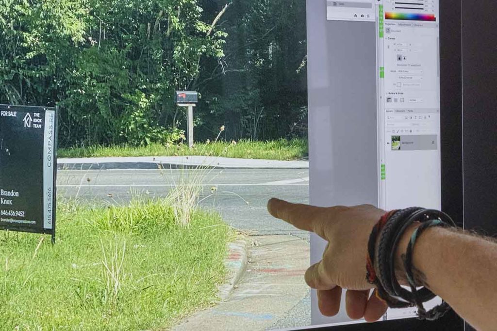 finger pointing to weeds on computer screen