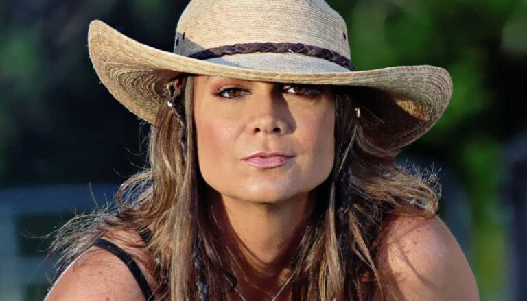 Singer-songwriter Bridgette Tatum in a straw hat for Bridgette Tatum’s Songwriter Journey.